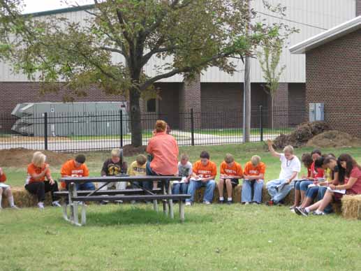Students at Harrisburg Middle School study in their outdoor class room, which is a part of their new school garden area.