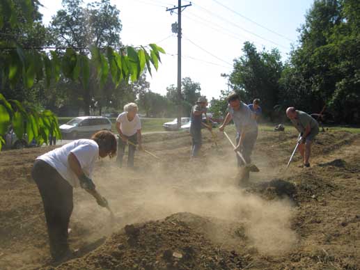 Hot and dry is the weather of the day, as the dirt blows the still unprotected soil around.  Mulch will soon be added to hold the moisture in the soil.